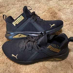 Black and Gold Softride Enzo Pumas Woman’s Size 11
